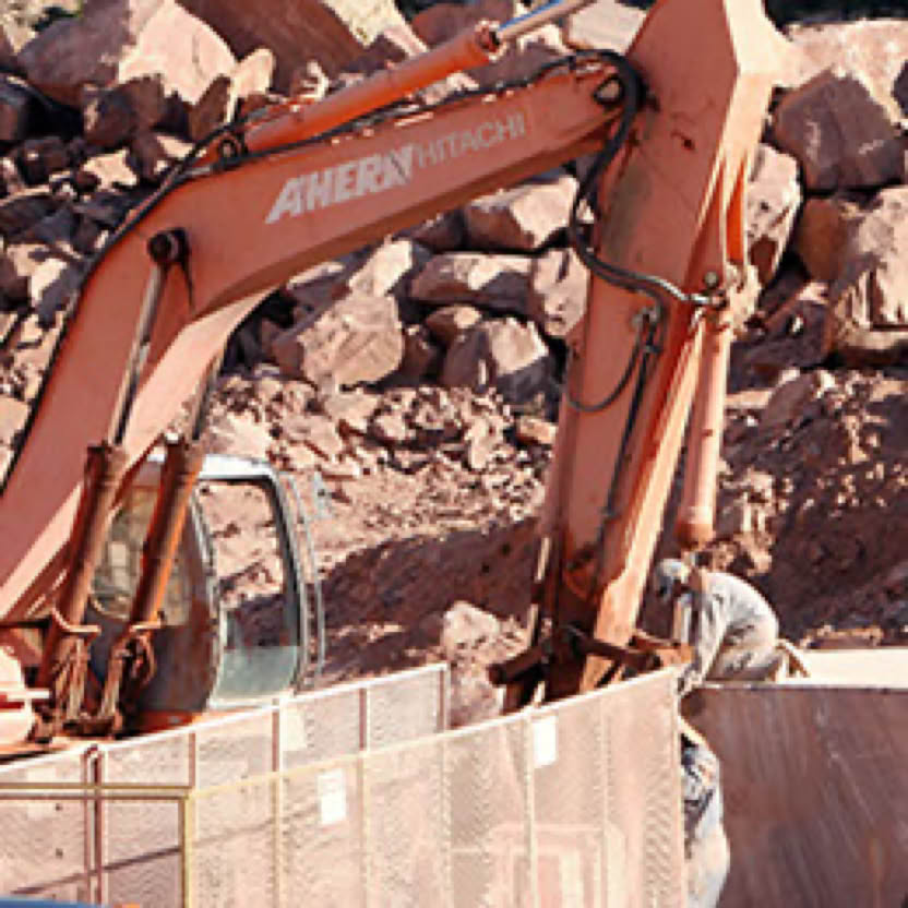 A man working the side heavy equipment