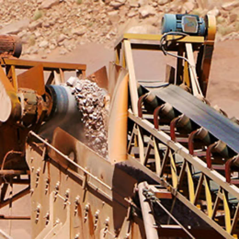 Rocks being sorted by a conveyor belt.